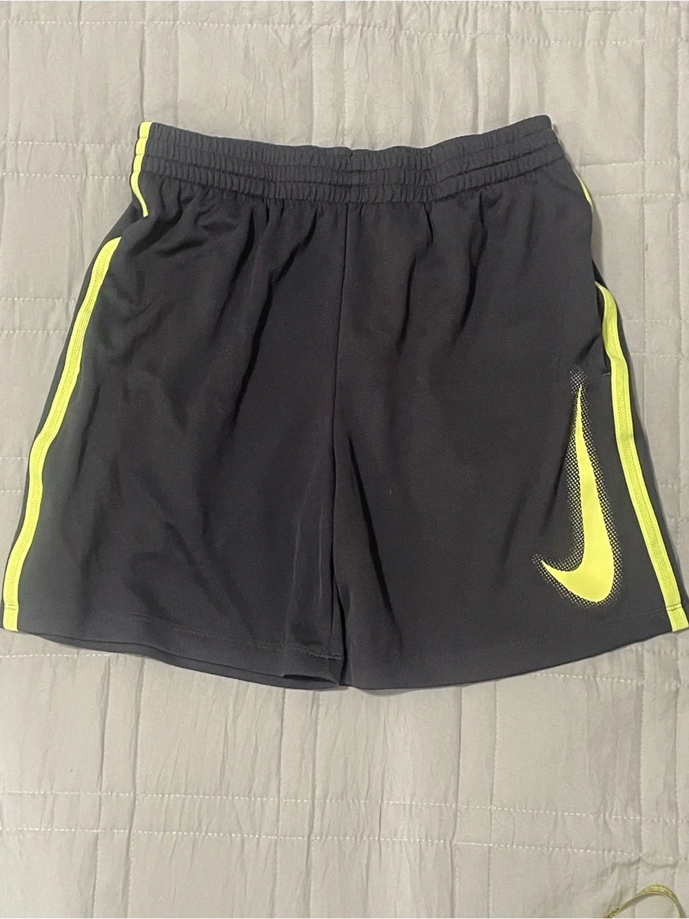 Nike Kids Black Athletic Shorts with Neon Yellow Swoosh